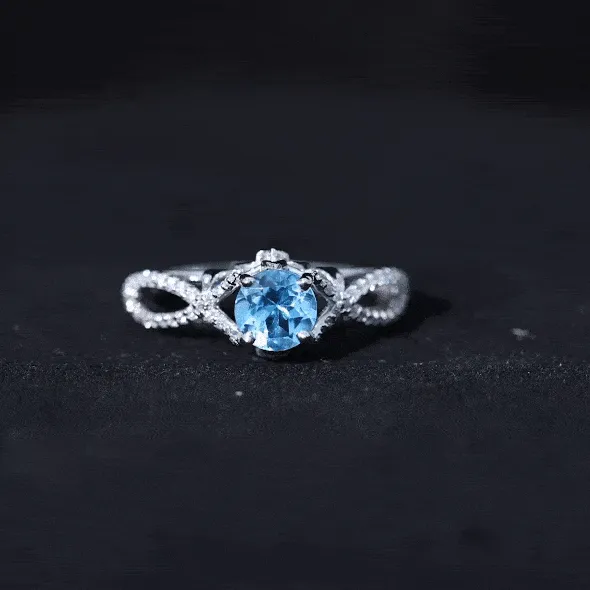 Designer Swiss Blue Topaz and Diamond Crossover Engagement Ring